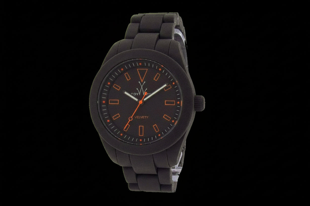ToyWatch velvety gun watch with orange markers, featuring a sleek design and durable strap for stylish everyday wear.