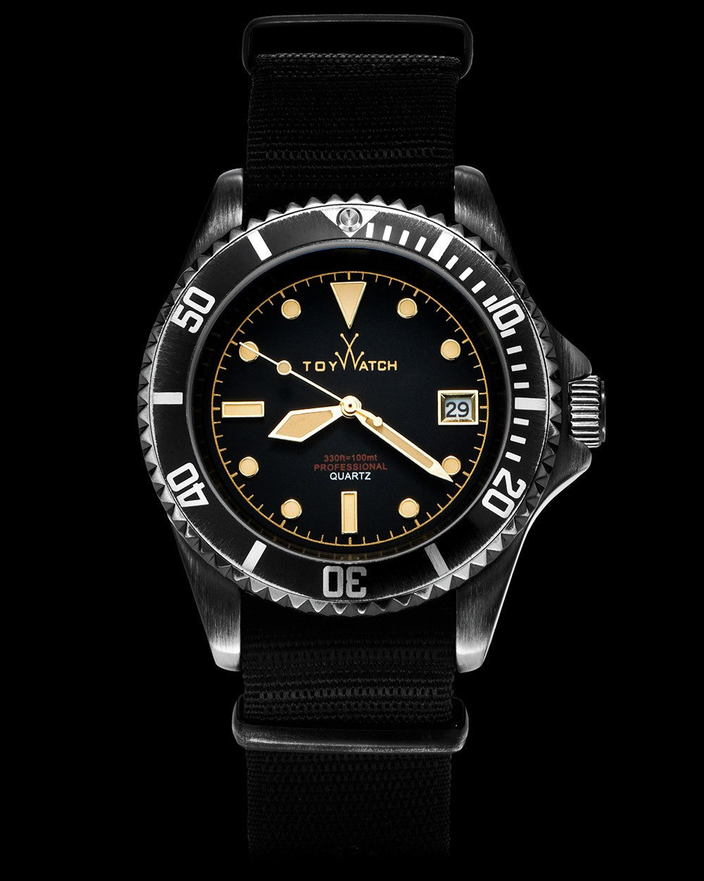 ToyWatch vintage black watch with three hands and a canvas strap, showcasing a classic design with a black dial and minimalist style.