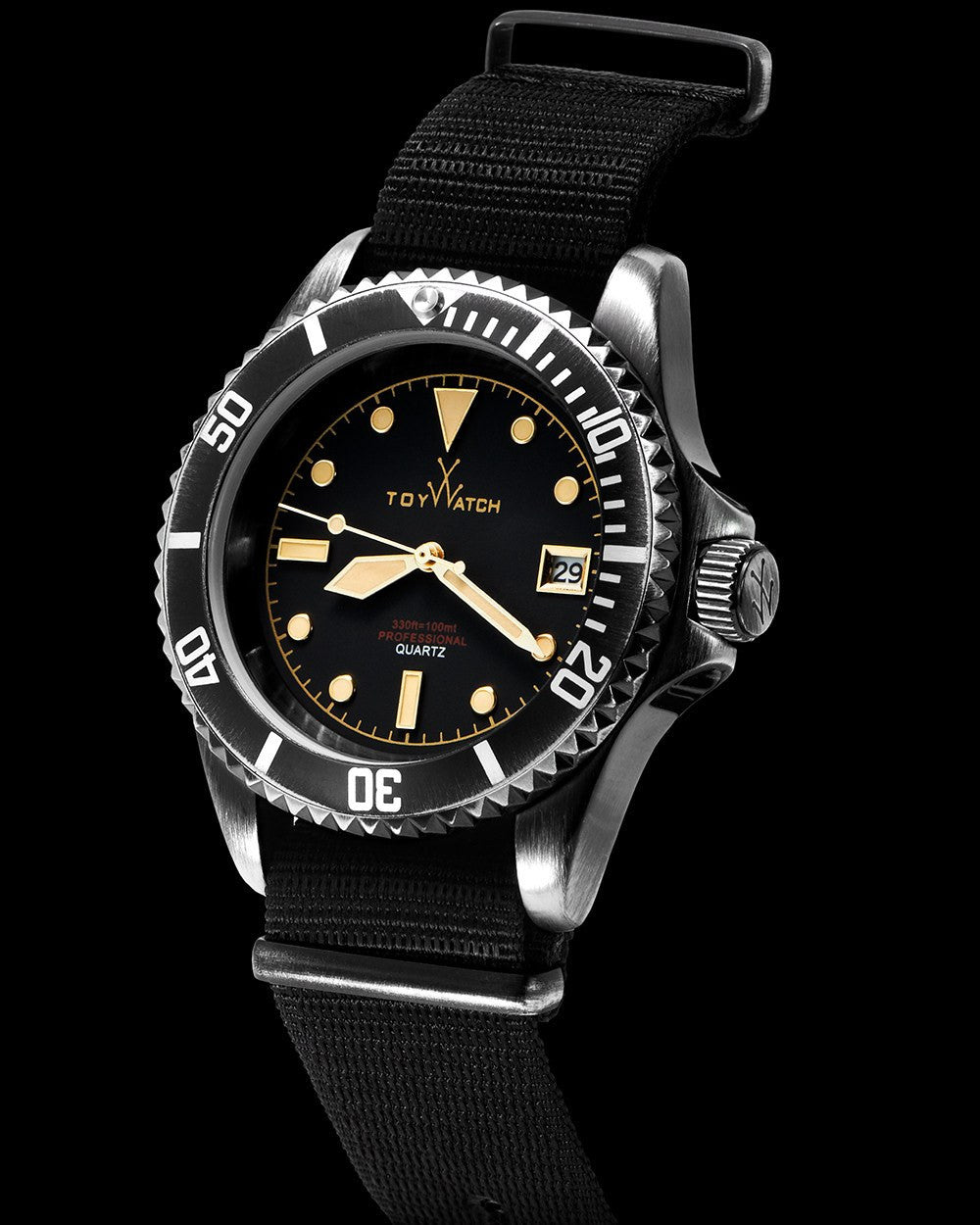 ToyWatch vintage black 3-hand watch with canvas strap, showing side view of the classic timepiece design.