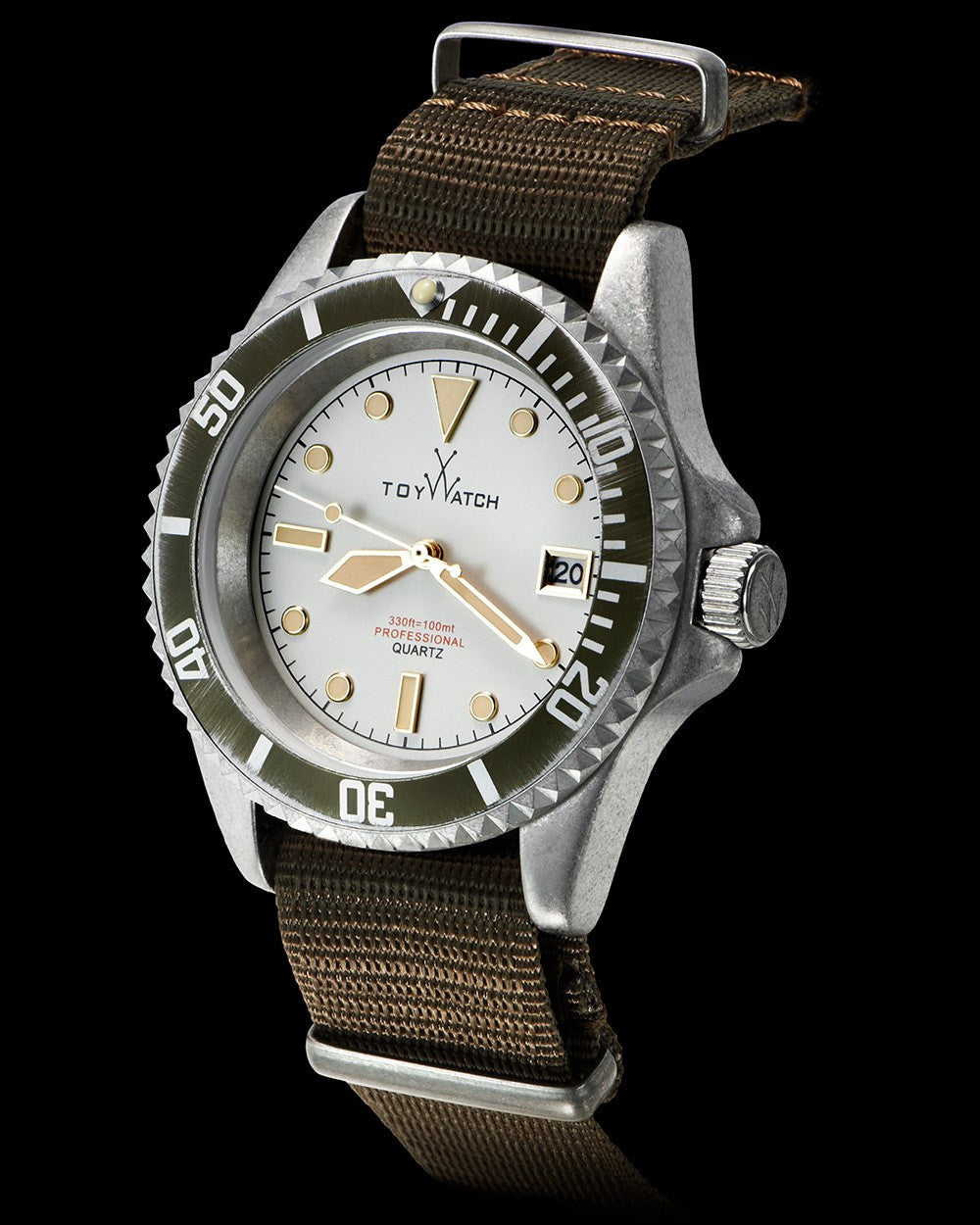 ToyWatch vintage 3-hand watch with green dial and canvas strap, side view showing classic design and durable strap material.